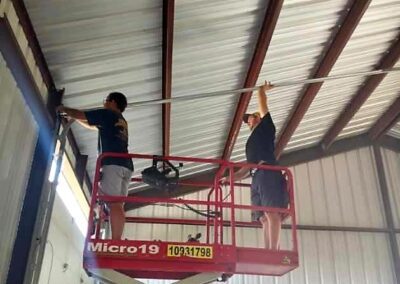 commercial steel building garage doors being installed